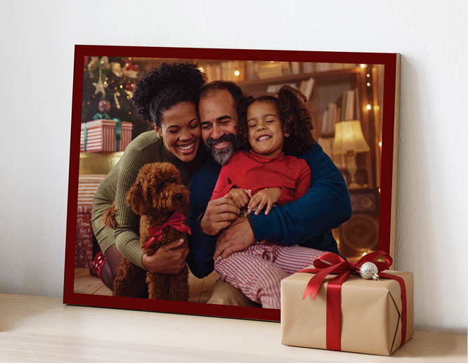 A personalized wood print showcasing a warm family photo on Christmas