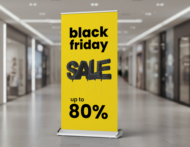 Black Friday retractable banner in yellow and black advertising up to 80% off sale in a shopping mall.