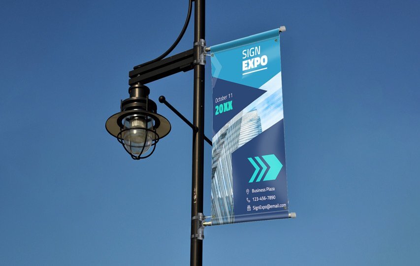 Sign Expo blue pole banner with event dates and contact details.